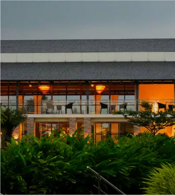 Resort building glowing with lights in the evening