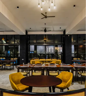 Restaurant dining area with yellow chairs