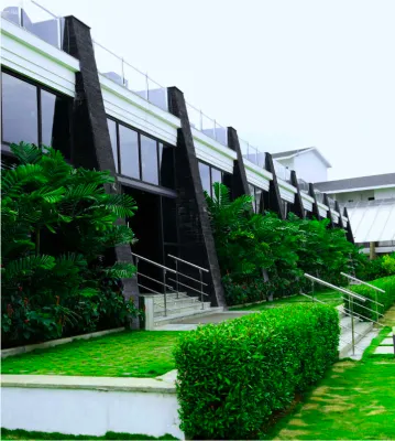 Resort rooms with balconies overlooking greenery