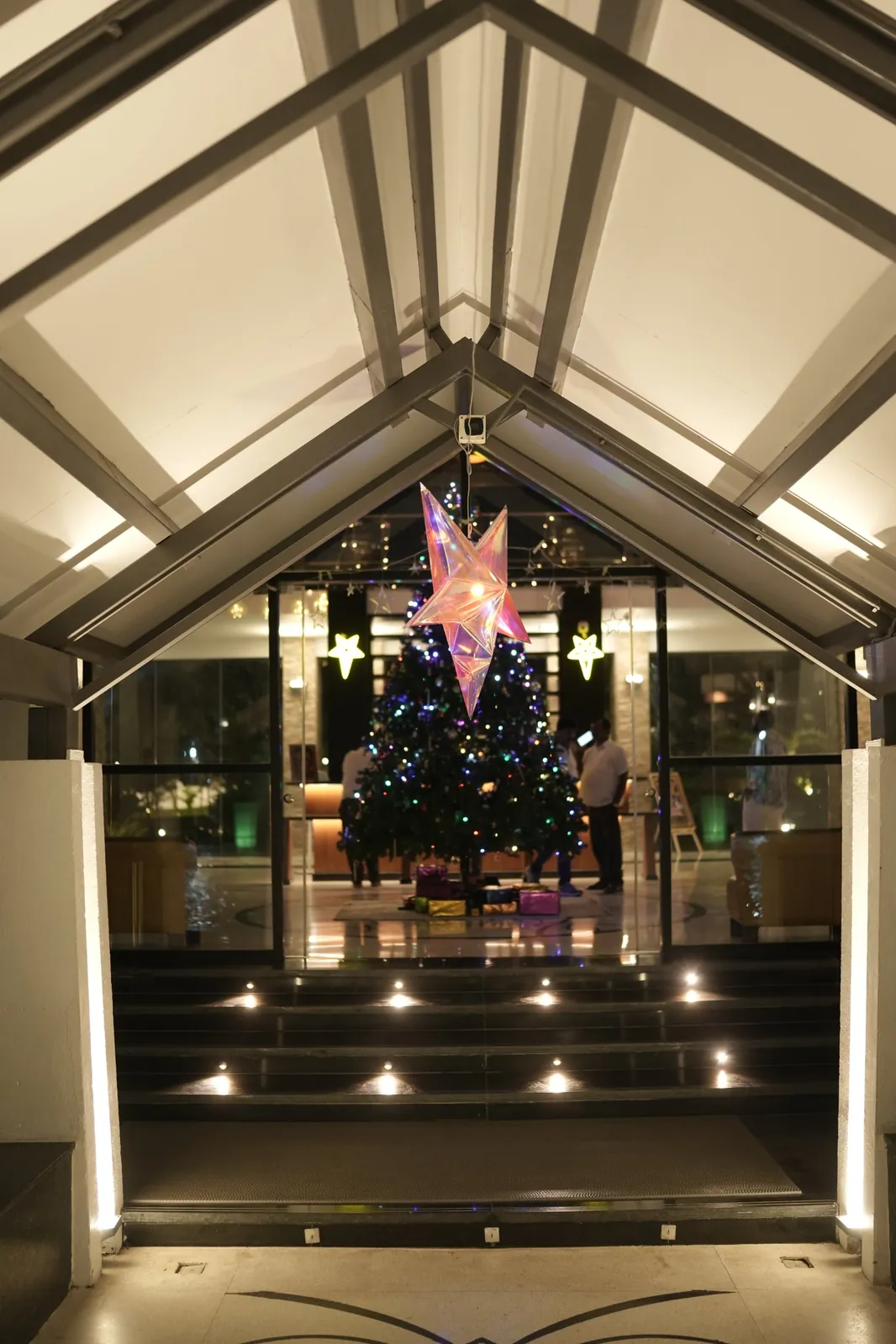 Christmas tree and star in the lobby decorated for New Year at Sportico Resorts