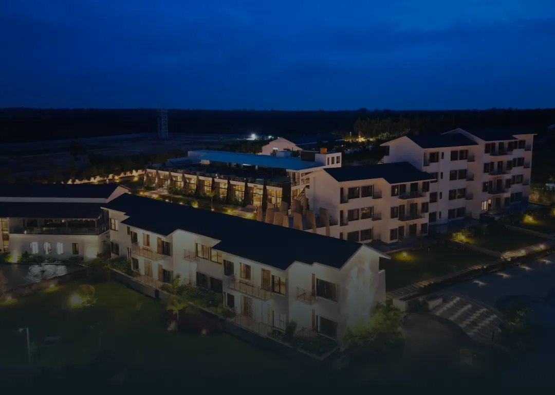 Aerial view of Sportico Resorts near Bangalore lit up at night