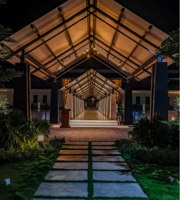 Lit walkway to the entrance at Sportico Resorts near Bangalore