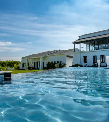 Infinity pool beside the villas at Sportico Resorts near Bangalore