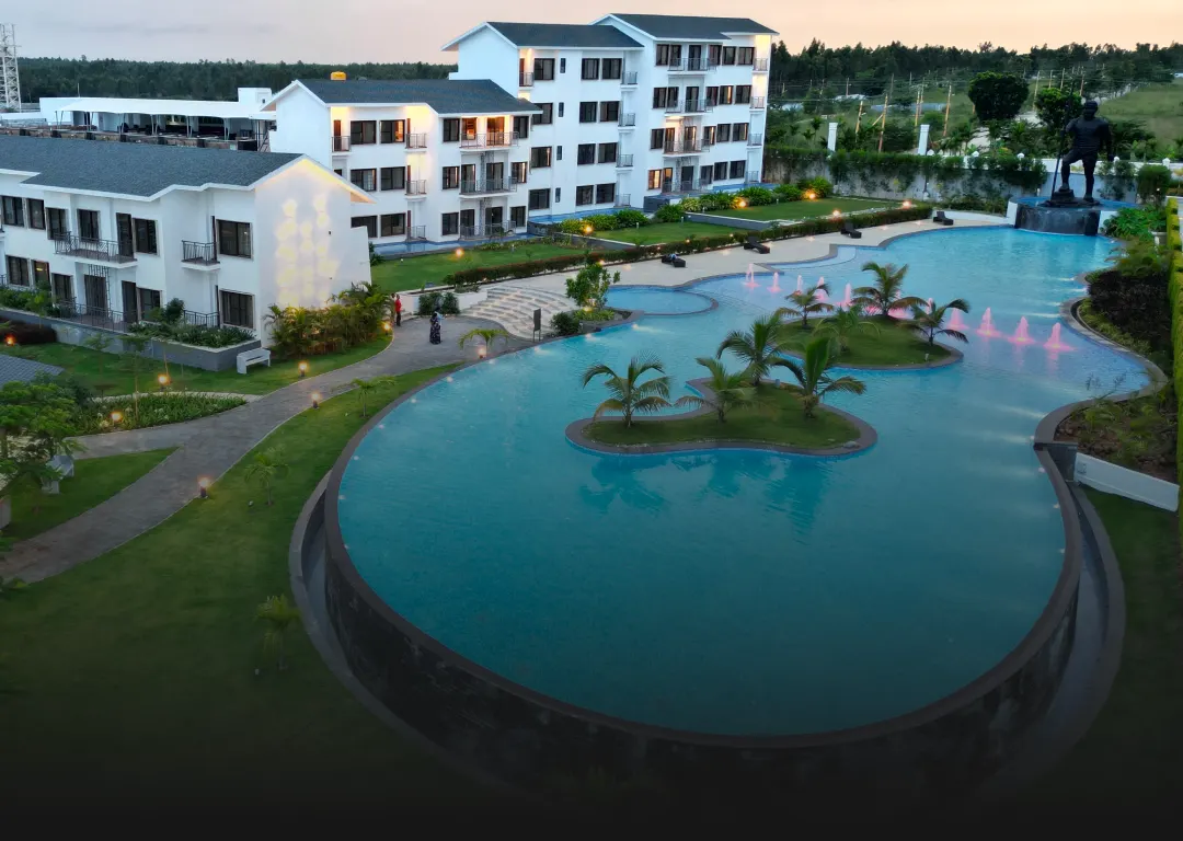 Infinity pool and villas at Sportico Resorts near Bangalore
