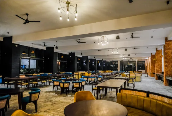 Saffron Restaurant dining hall at Sportico Resorts near Bangalore